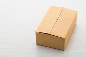 Paper box on wood background