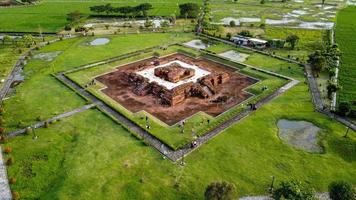 Karawang, Indonesia 2021- Aerial drone view of Blandongan Temple at Karawang and surrounded by green grass photo