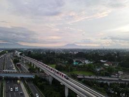 Jakarta, Indonesia 2021- Aerial view of Monorail movement on track moving fast taken at station Cibubur photo