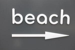 Beach sign with arrow photo