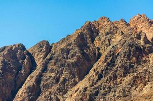 Rocky mountain peaks and blue sky photo