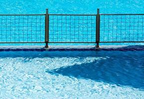 Metal fence in a pool photo