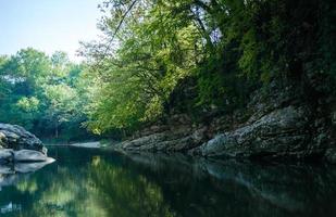 Rocky shore of a mountain river photo