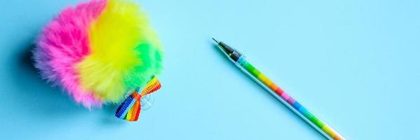 Multi-colored pen on blue background photo