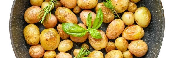 Golden roasted potatoes in the skin photo