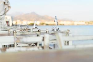 Cafe tables on the sea mediterranean embankment photo