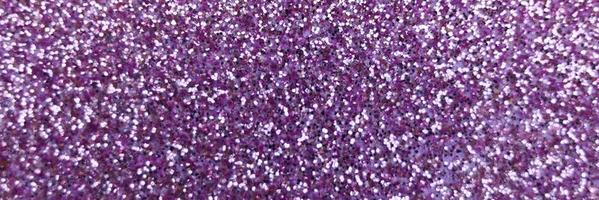 Blurred purple glitter background close-up