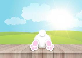 Easter background with a cute bunny on a wooden table vector