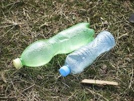 Plastic water bottles on the ground photo