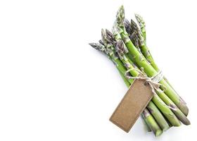 Fresh green asparagus with an empty tag photo