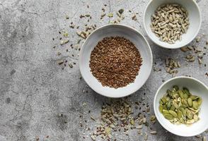 Mix of different seeds for a healthy salad photo