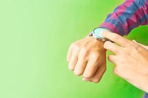 Man wears a smart watch in everyday lifestyle photo