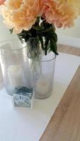 Peonies in a vase on a table photo