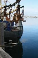 Fishing trawler in a harbor photo