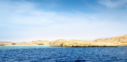 Rocky seashore during daytime photo