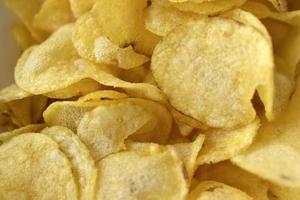 Yellow beautiful delicious chips close-up in a restaurant photo