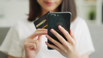 Woman Typing in a Credit Card Number video