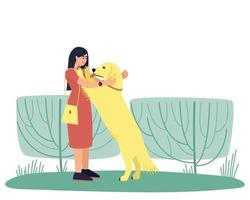 Dog handler hugs her golden Labrador dog