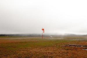 Wind sock on a foggy day photo