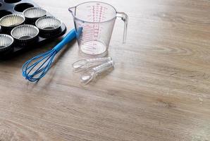 Bakery kitchen tools on wooden background photo