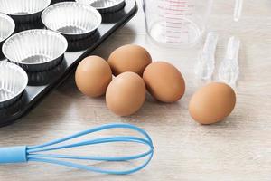 Bakery kitchen tools on wooden background photo