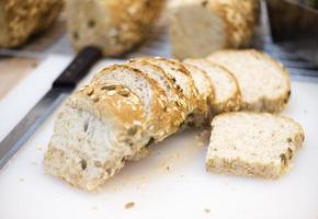 White whole-wheat bread on a wooden table photo