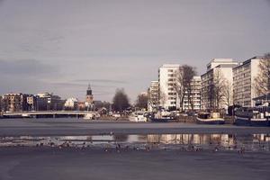 Turku, Finland, Mar 23, 2021 - View of the Turku Cathedral and the Aura river. photo