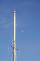 Boat mast against the sky photo