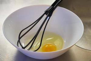 Egg with a whisk photo