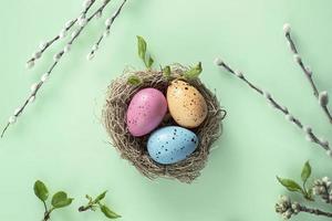 Easter background with pussy-willow painted eggs in the nest. Orthodox Easter, pussy-willow Sunday photo