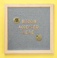 Golden virtual money Bitcoin coin with frame and text Bitcoin Accepted Here. Concept of bitcoin payment, shopping or purchase and cryptocurrency accepted photo
