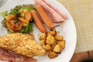 American breakfast set on an old wood vintage table background photo