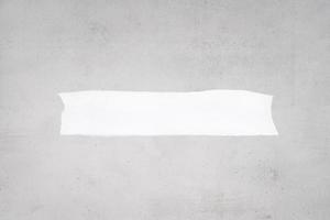 Blank ripped white paper on a gray concrete background to add text. Mock up template photo