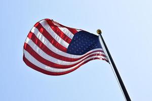 Flag of America waving on a pole photo