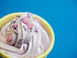 Pink soft ice cream blue background photo