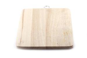 Wooden butcher block with scratches on a white background photo