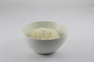 Steamed rice in a bowl on a white background photo