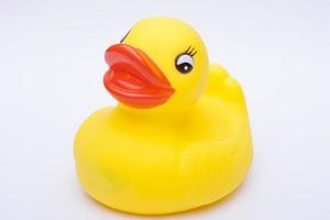 Yellow rubber duck for a kid's bath time, isolated on white background photo