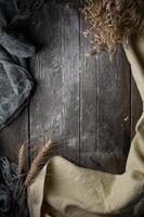 Cloths and wheat on wood floor with copy space photo