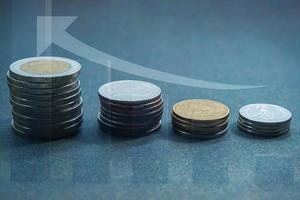 Graph with a stack of Thai baht coins depicting stair steps, currency coins in 1, 2, 5, and 10 baht, growth concept photo