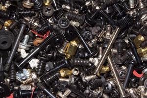 Close up of a pile of metal screws photo
