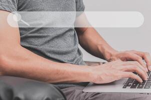 Person using a laptop computer to find information and knowledge online photo