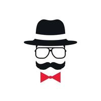 Hipster in hat, glasses and red bow tie. Portrait of man with mustache.