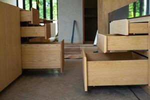 Opening wooden shelfs under installation inside the house under construction photo