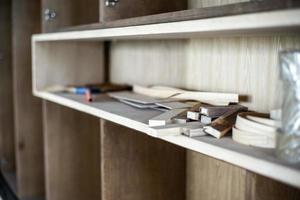 Selective focus on the wooden stacks in the cupboard under installation photo