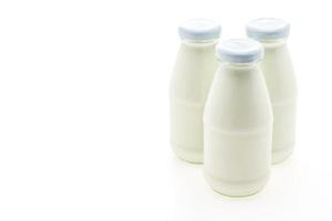 Vaso de botella de leche aislado sobre fondo blanco. foto