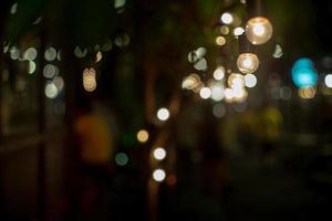 Abstract selective focus objects of vintage lamps with bokeh lights in background photo