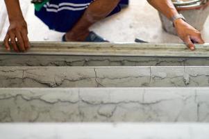Selective focus on rough cement surface on the floor photo
