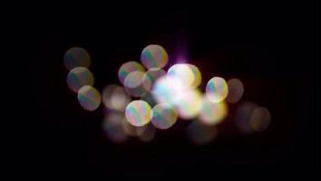 Realistic colorful light bokeh blur on black background. video