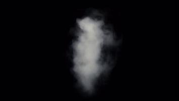Realistic white smoke floating on black background.